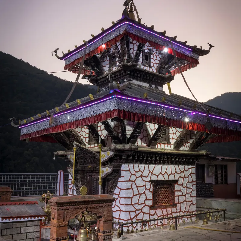 Two-story pagoda style Tal Barahi Temple situated on an island in Phewa Lake Pokhara Nepal during twilight.
